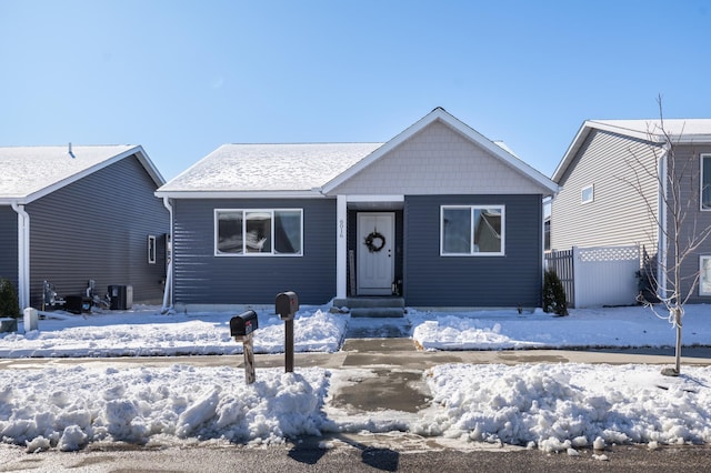 bungalow-style house featuring fence