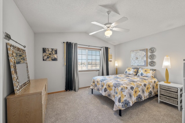 carpeted bedroom featuring baseboards, a textured ceiling, ceiling fan, and vaulted ceiling