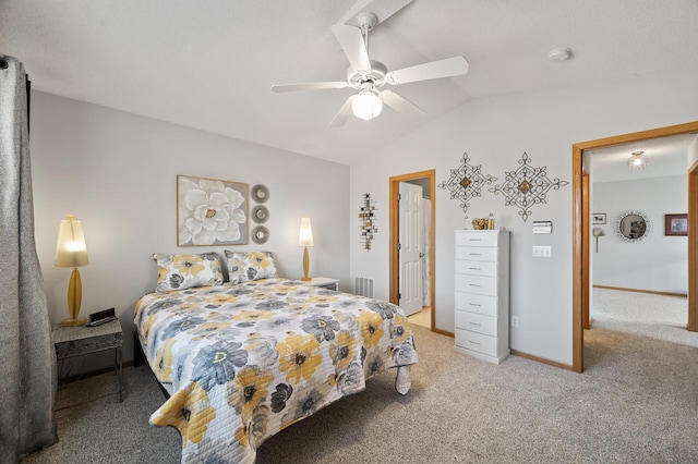 bedroom featuring a ceiling fan, visible vents, baseboards, lofted ceiling, and light carpet