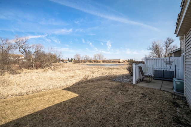 view of yard with a patio area and a rural view