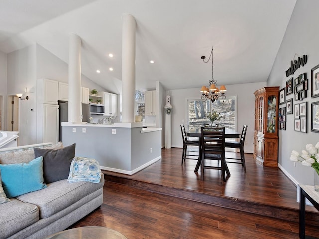 3011 Inverness Ln, Mound, MN 55364 - dining room featuring vaulted ceiling, dark wood-style floors, a chandelier, baseboards, and recessed lighting