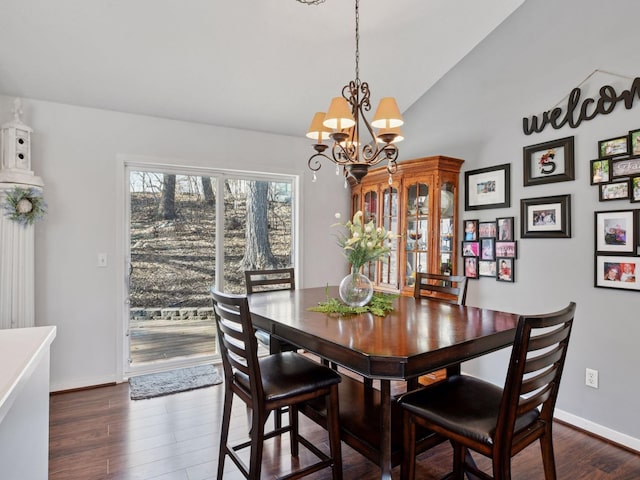 3011 Inverness Ln, Mound, MN 55364 - dining space featuring a chandelier, vaulted ceiling, dark wood-style floors, and baseboards