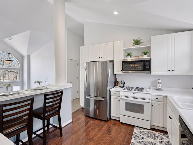 3011 Inverness Ln, Mound, MN 55364 - kitchen featuring appliances with stainless steel finishes, lofted ceiling, dark wood finished floors, white cabinets, and open shelves