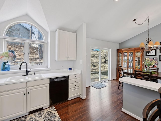 3011 Inverness Ln, Mound, MN 55364 - kitchen featuring black dishwasher, vaulted ceiling, a sink, a chandelier, and white cabinets