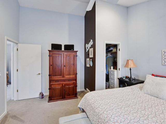 3011 Inverness Ln, Mound, MN 55364 - carpeted bedroom featuring high vaulted ceiling, baseboards, a walk in closet, ceiling fan, and a closet
