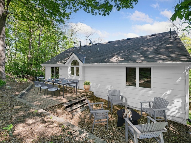 3011 Inverness Ln, Mound, MN 55364 - rear view of house with outdoor dining area, a shingled roof, and a wooden deck