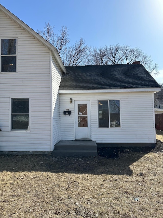 view of front of house featuring roof with shingles