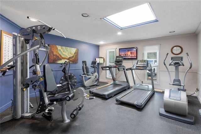 workout area with recessed lighting, baseboards, a textured ceiling, and crown molding