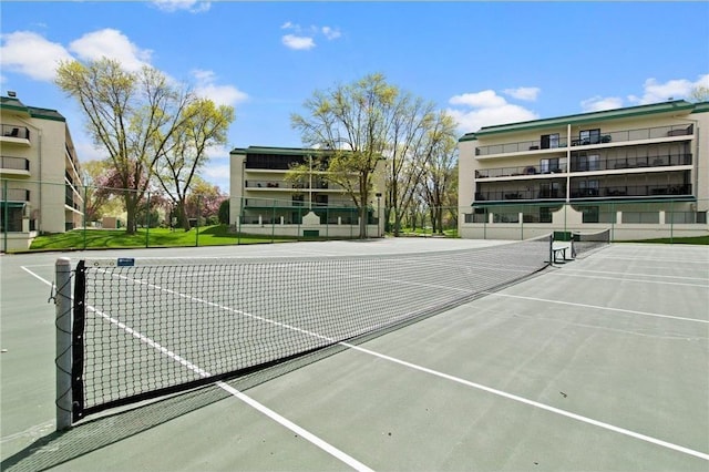 view of tennis court with fence