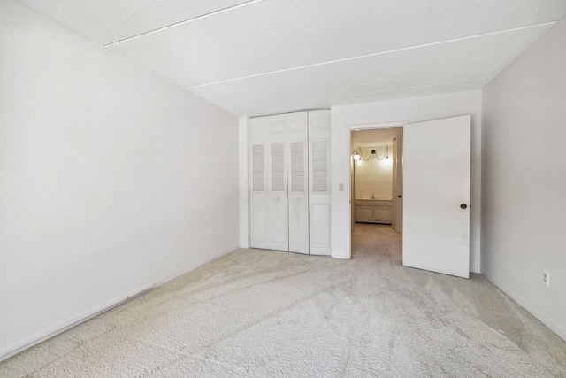 unfurnished bedroom with a closet and carpet flooring