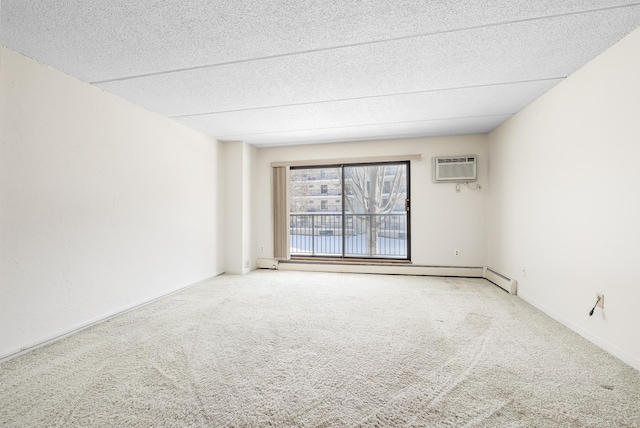 carpeted spare room featuring a wall mounted air conditioner, a baseboard heating unit, baseboards, and a textured ceiling