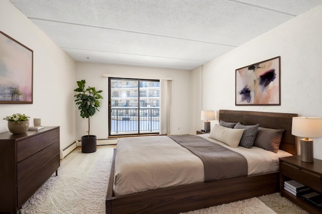 bedroom featuring a textured ceiling, light colored carpet, and a baseboard radiator