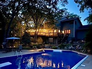 pool featuring a patio and a diving board