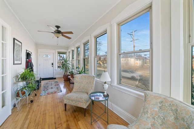 sunroom with ceiling fan