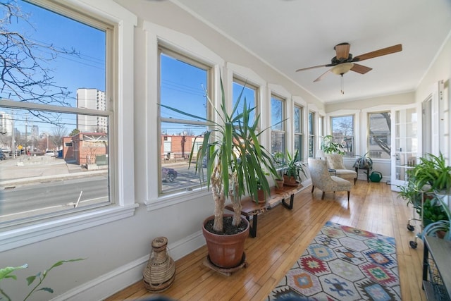 sunroom with ceiling fan