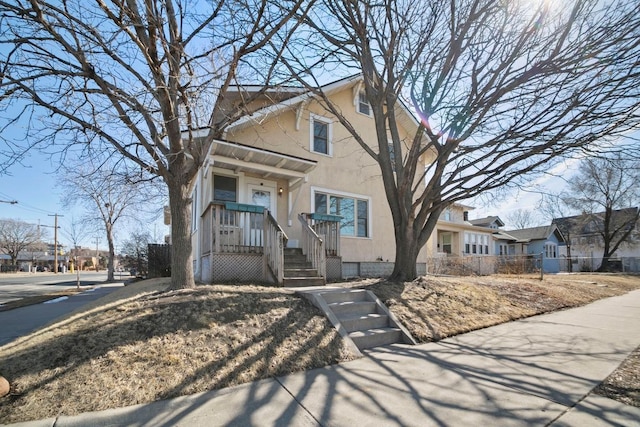 view of front of property featuring a residential view and stucco siding