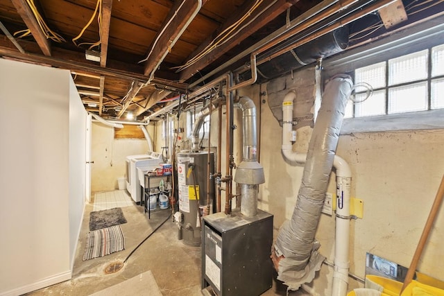 basement featuring gas water heater and washer and dryer