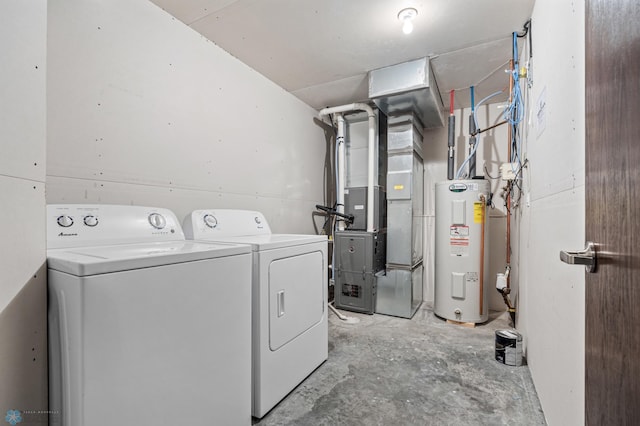 clothes washing area with heating unit, electric water heater, and washing machine and clothes dryer