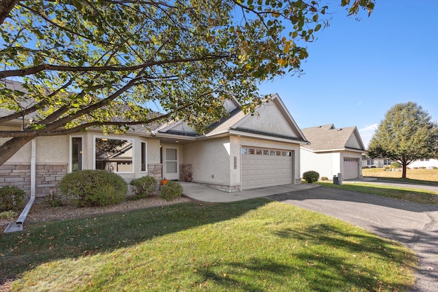 view of front facade featuring a front lawn, stucco siding, a garage, stone siding, and driveway