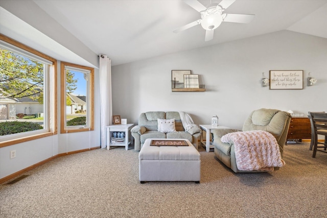 living room with a ceiling fan, baseboards, visible vents, carpet floors, and lofted ceiling