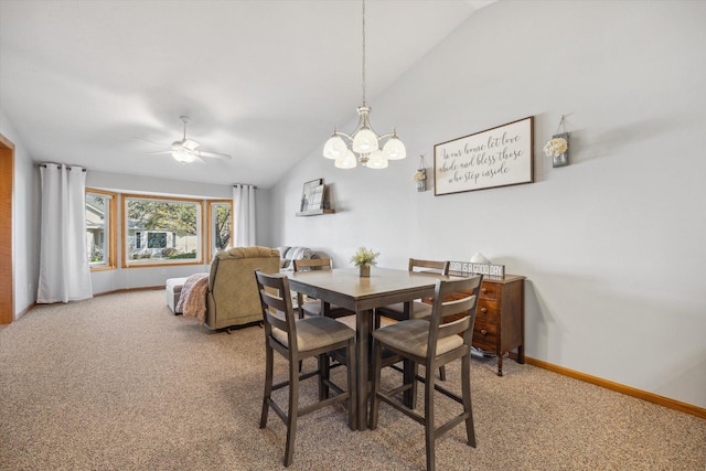 dining area with ceiling fan with notable chandelier, lofted ceiling, light colored carpet, and baseboards