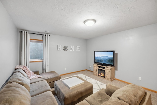 living area with baseboards, light carpet, and a textured ceiling