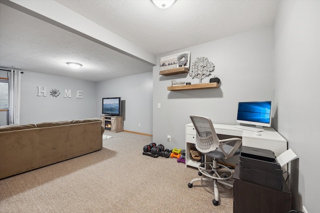 office area featuring carpet flooring, a textured ceiling, and baseboards