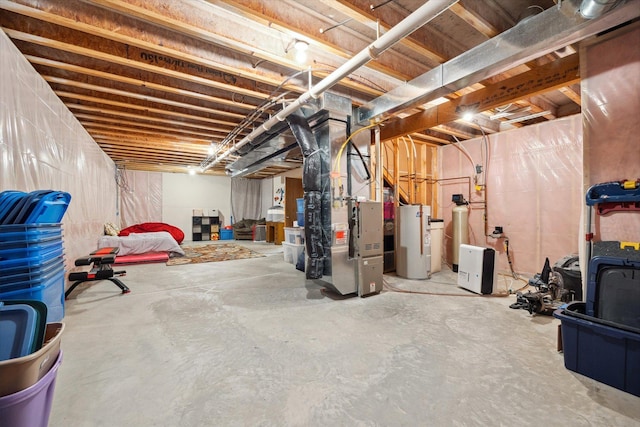 unfinished below grade area featuring heating unit and electric water heater