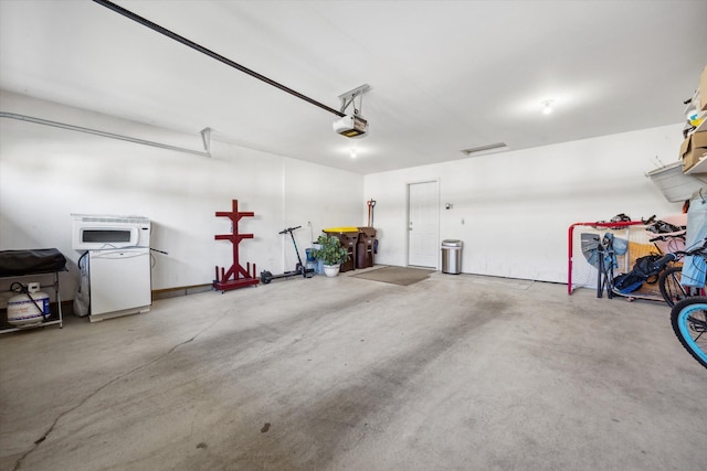 garage with refrigerator and a garage door opener