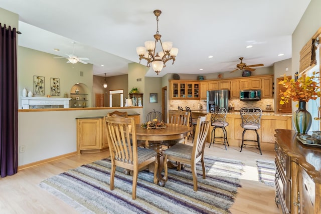 dining area with recessed lighting, ceiling fan with notable chandelier, and light wood-type flooring