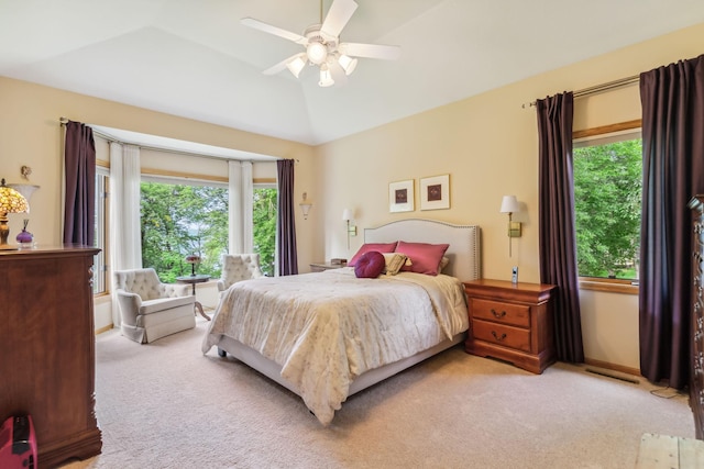 bedroom featuring baseboards, carpet floors, lofted ceiling, and ceiling fan