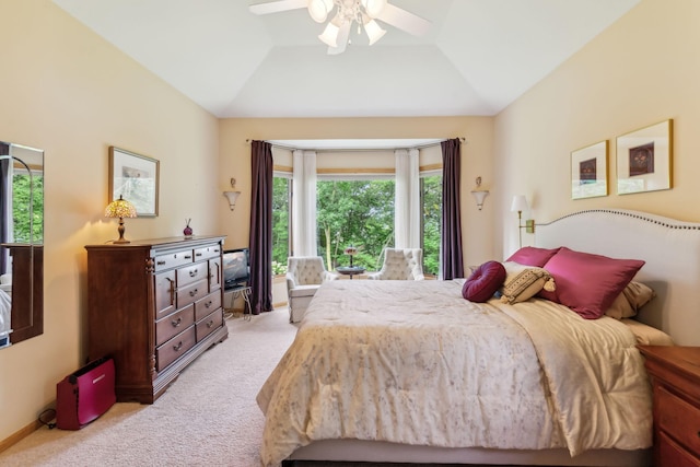 bedroom featuring baseboards, light carpet, a ceiling fan, and vaulted ceiling