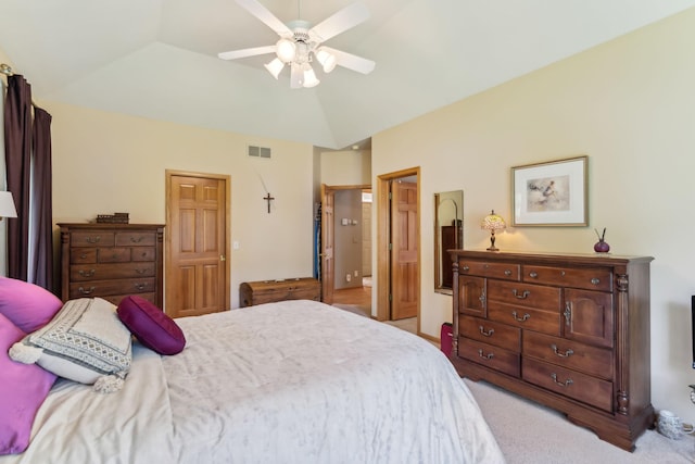 bedroom with visible vents, light carpet, ceiling fan, and vaulted ceiling