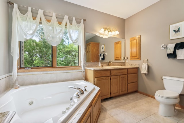 full bath featuring toilet, a whirlpool tub, tile patterned flooring, baseboards, and vanity