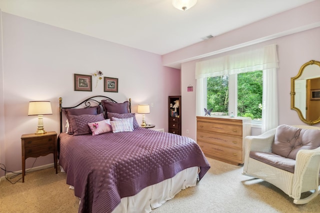 carpeted bedroom with visible vents