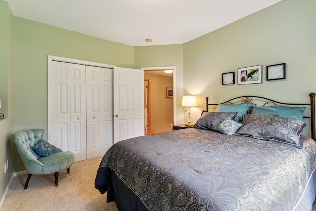 bedroom featuring carpet, a closet, and baseboards