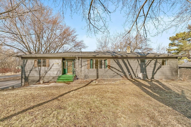 rear view of house with cooling unit