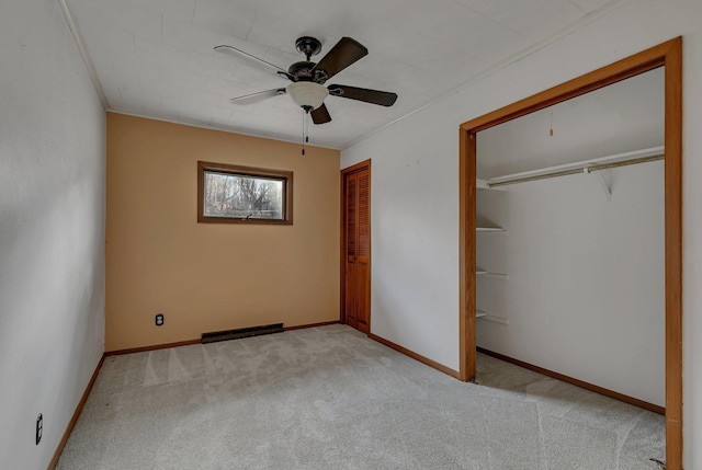 unfurnished bedroom with baseboards, carpet floors, two closets, and visible vents