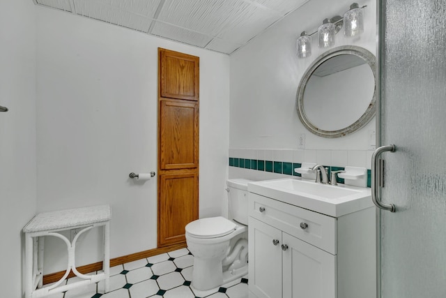 bathroom with tile patterned floors, toilet, and vanity