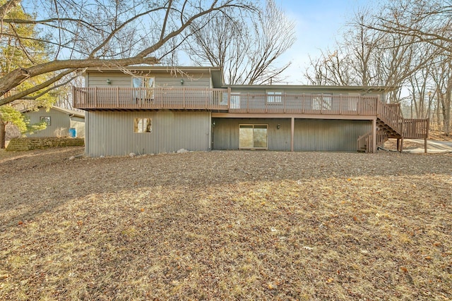 back of house with stairs and a wooden deck