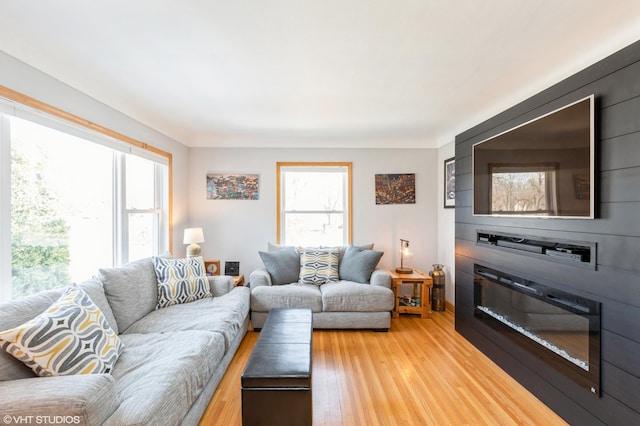 living area featuring a wealth of natural light and light wood-style floors