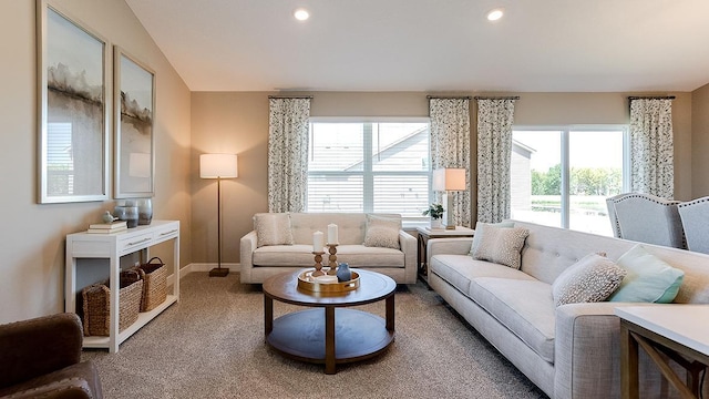 living room with lofted ceiling, recessed lighting, baseboards, and carpet floors