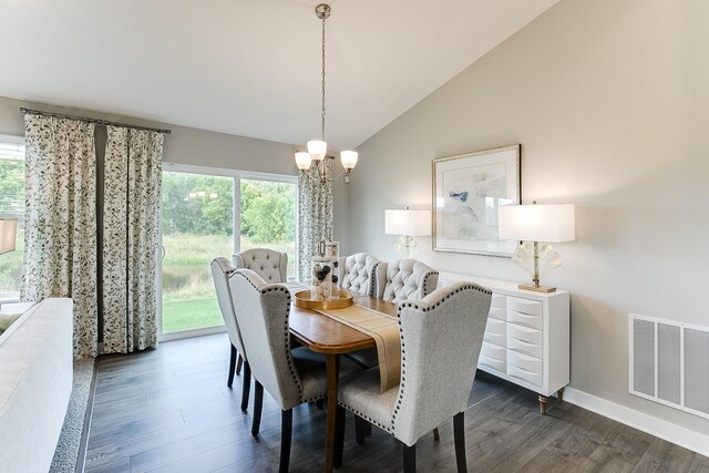 dining area featuring visible vents, a healthy amount of sunlight, and dark wood-style flooring