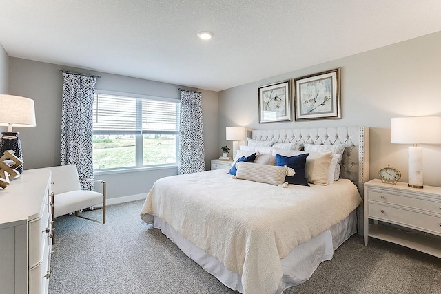 bedroom with baseboards and carpet floors