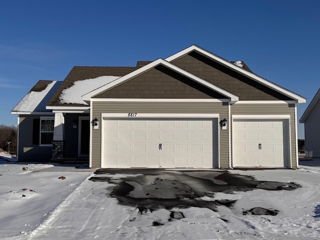 view of front of property with a garage and driveway