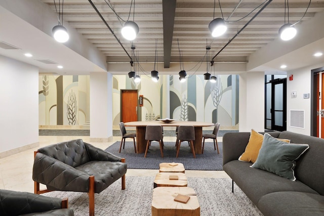 living area featuring tile patterned floors, baseboards, and visible vents