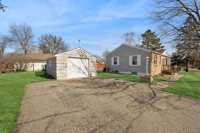 exterior space featuring an outbuilding and driveway