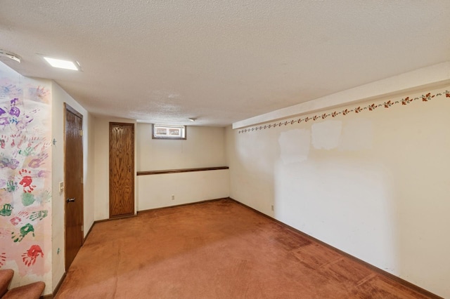 basement featuring light carpet and a textured ceiling