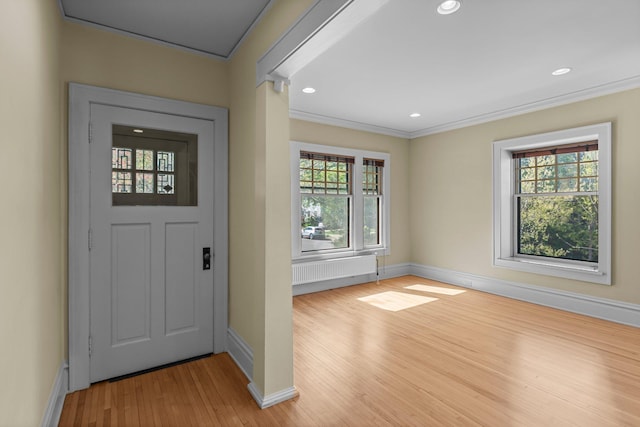 entryway featuring baseboards, light wood-style flooring, plenty of natural light, ornamental molding, and recessed lighting