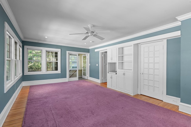unfurnished bedroom featuring ornamental molding, light wood-style flooring, baseboards, ceiling fan, and recessed lighting